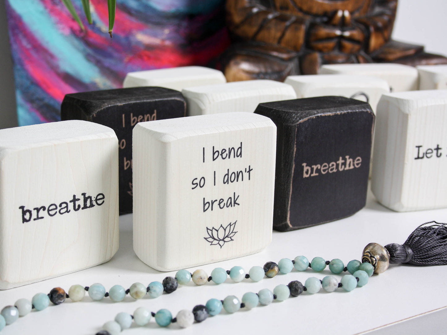 series of yoga themed quote blocks, the focused one says "I bend so I don't break"