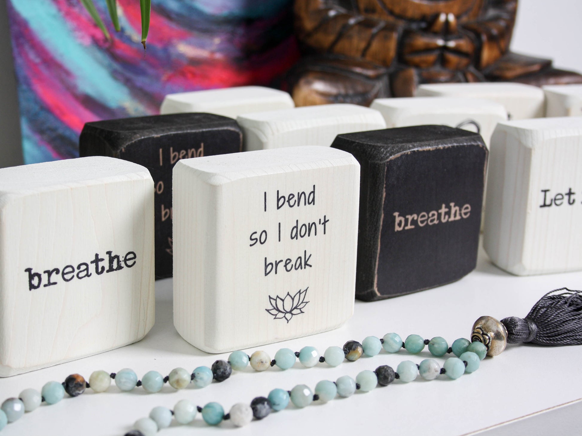 series of yoga themed quote blocks, the focused one says "I bend so I don't break"
