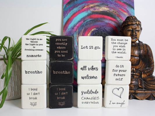 12 yoga themed quote blocks all stacked up