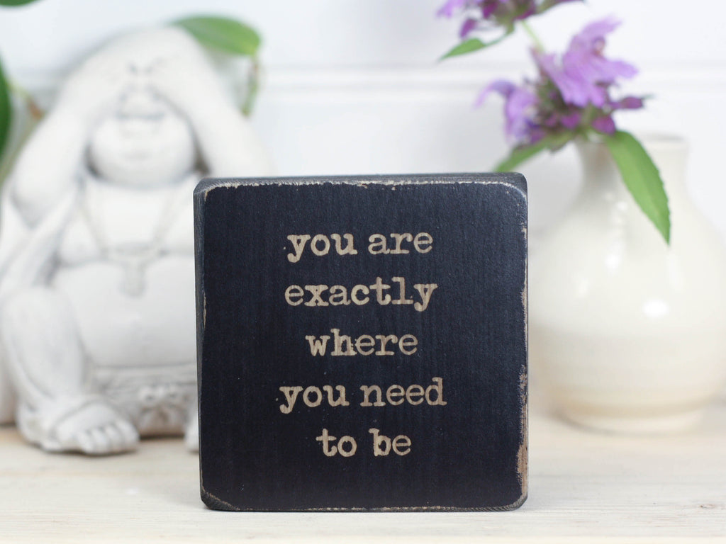Mini wood sign in distressed black with the saying "You are exactly where you need to be".
