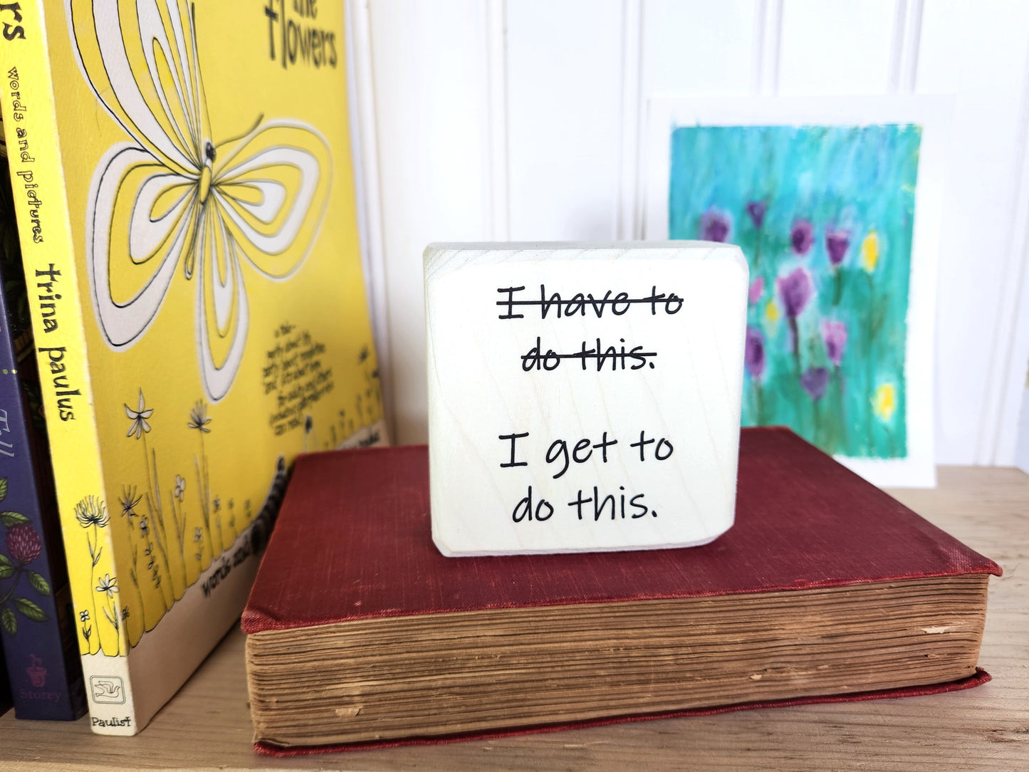 Motivational quote block sign on a book 
