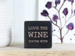 Mini wood bar sign in distressed black with the saying "Love the wine you're with".