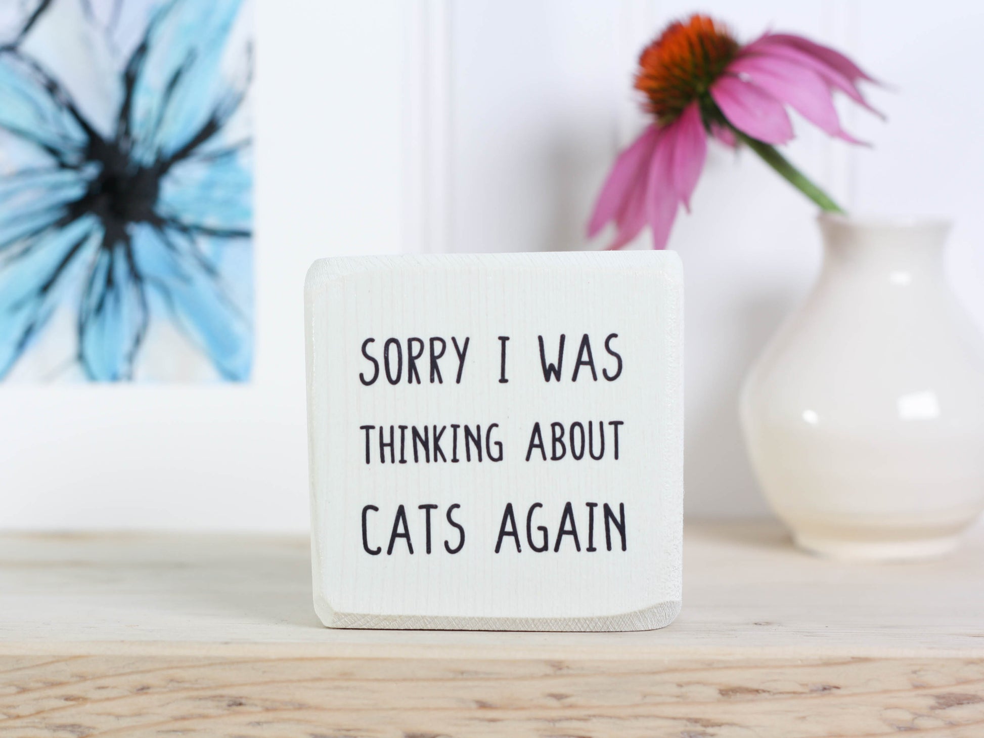 Mini wood sign in whitewash with the saying "Sorry I was thinking about cats again".