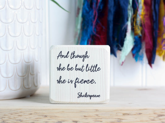 whitewashed mini wood sign with the text And though she be but little, she is fierce. - Shakespeare