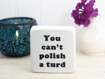 mini whitewashed wood sign with the text "you can't polish a turd"