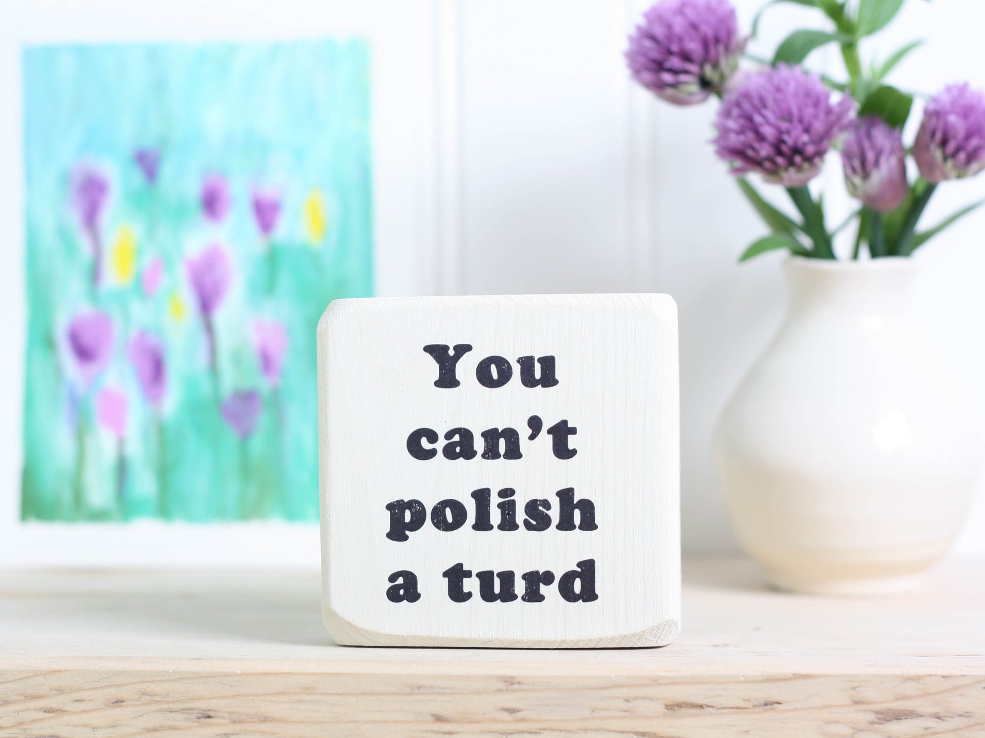 mini whitewashed wood sign with the text "you can't polish a turd"