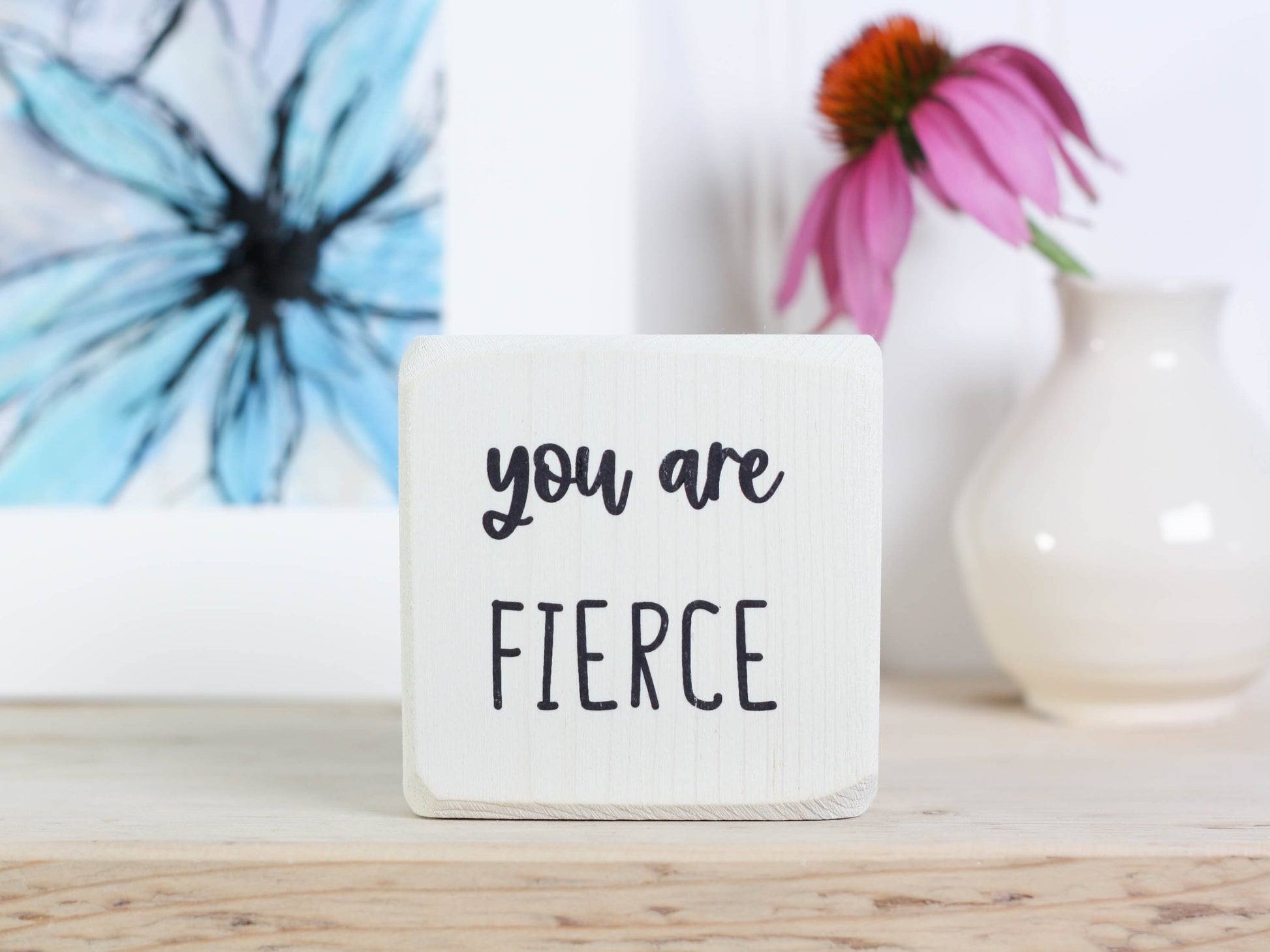 Small, freestanding, whitewash, solid wood sign with saying "you are fierce"