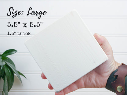 Sizing photo for 5.5 inch square small sign showing the sign in a hand.