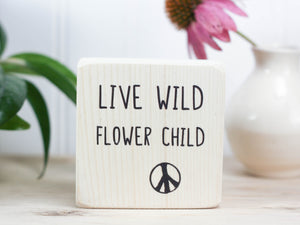 Mini wood desk sign in whitewash with the saying "Live wild flower child".