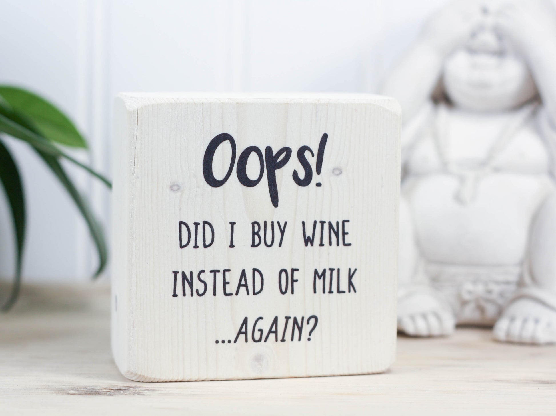 Mini wood bar sign in whitewash with the saying "Oops! Did I buy wine instead of milk...again?"