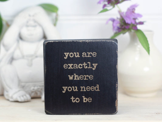 Mini wood sign in distressed black with the saying "You are exactly where you need to be".