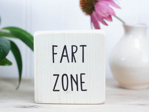 Small, freestanding, whitewash, solid wood sign with funny "fart zone" saying.
