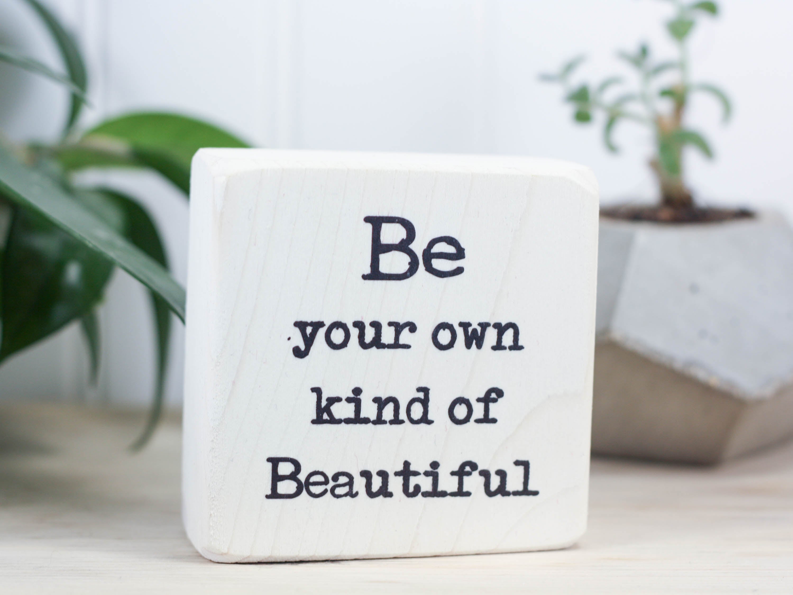 Small freestanding shelf decor in whitewash with the saying "Be your own kind of Beautiful".
